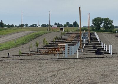 Nice RV park with a wide gravel way and a sitting area